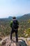 Vertical shot of a Hispanic hiker on top of mount Tlaloc in Mexico