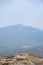 Vertical shot of a Hispanic hiker on top of mount Tlaloc in Mexico