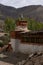 Vertical shot of the historic Tibetan Buddhist holy site Ghar Gumba Monastery in the Himalayas