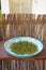 Vertical shot of home planted bittercress in a blue bowl