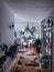 Vertical shot of the hotel\'s reception room decorated with various houseplants