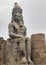 Vertical shot of a huge statue of Ramesses II in Luxor Temple, Egypt