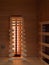 Vertical shot of the Interior view of a private infrared sauna with heaters and variable backrest