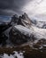 Vertical shot of the jagged peak of Seceda mountain in the Dolomite Alps on a cloudy winter day