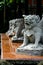 Vertical shot of Japanese lion sculptures in a building