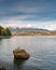 Vertical shot of the lake in the Stanley Park in Vancouver with the view of Lions Gate Bridge