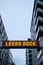 vertical shot of a Leeds dock sign lite up