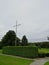 Vertical shot of a Lidice Memorial cross statue to the Children Victims of World War II in a park