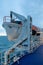 Vertical shot of a lifeboat on the board of the ferry in the ocean under the cloudy sky