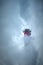 Vertical shot of a lighthouse covered in white fog