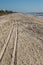 Vertical shot of long tire trails on a beach in Emerald Isle,North Carolina