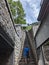 Vertical shot of a male from behind walking up the stairs to Citadel, in Denant, Belgium