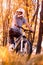 Vertical shot of a male professional mountain biker wearing a helmet in park