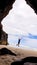 Vertical shot of a male running in the beach