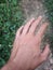 Vertical shot of a man\'s hand with bulging veins on a blurred background