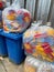 Vertical shot of many red, yellow and blue polypropylene plastic wastes