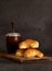 Vertical shot of medialunas croissants and yerba mate infusion placed on a wooden cutting board