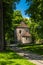 Vertical shot of a medieval rotunda at Castle Hill with an alley and trees around in Cieszyn, Poland