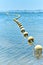 Vertical shot of Mediterranean seascape with floating buoys. Spain