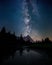 Vertical shot of the Milky Way rising above in Rocky Mountain