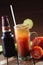 Vertical shot of a mug filled with beer, lime, and salt on a blurred background