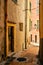 Vertical shot of a narrow alley and buildings captured in Menton, French Riviera, France