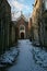 Vertical shot of a narrow pathway towards a church