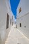 Vertical shot of narrow pedestrian street in Vejer de la Frontera village