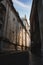 Vertical shot of a narrow street with buildings alongside it in Lisbon, Portugal