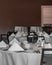 Vertical shot of neat tables in a nice, empty and clean restaurant