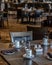 Vertical shot of neat tables in a nice, empty and clean restaurant