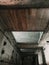 Vertical shot of an old abandoned building weathered ceiling details