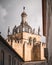 Vertical shot of The Old Cathedral of Coimbra under a cloudy sky in sunlight in Portugal