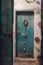 Vertical shot of an old green wooden door with a padlock, wreath and white metal candle holder