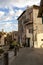 Vertical shot of old medieval residential buildings and paved streets in Italy