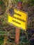 Vertical shot of an old metallic danger sign  \'Entering the property is prohibited\'