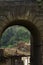 Vertical shot of an old weathered arch in Caprarola, Viterbo, Italy