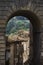 Vertical shot of an old weathered arch in Caprarola, Viterbo, Italy