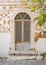 Vertical shot of an ornamented door and painted wall with geometric patterns in Pyre, Chios, Greece