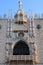 Vertical shot of the ornate statue in the southern part of the Doge\'s Palace in Venice, Italy