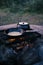 Vertical shot of an outdoor camping grill with pots