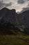 Vertical shot of the Passo Falzarego mountains under the cloudy sky in Dolomites, Italy
