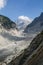 Vertical shot of a path amid rocky mountains