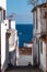 Vertical shot of the pathway between the white walls taking to the beach in Santa Cruz de la Palma