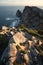 Vertical shot of Penas Cape cliffs at sunrise in Asturias, north of Spain