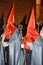 Vertical shot of penitent brotherhood in the streets of Valladolid during Holy Week