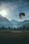 Vertical shot of people parachuting near mountains in Switzerland