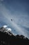 Vertical shot of people paragliding in the mountains