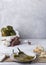 Vertical shot of peppers and garlic and other ingredients on a table