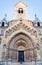 Vertical shot of a person standing in front of the Jaki Chapel in Budapest, Hungary